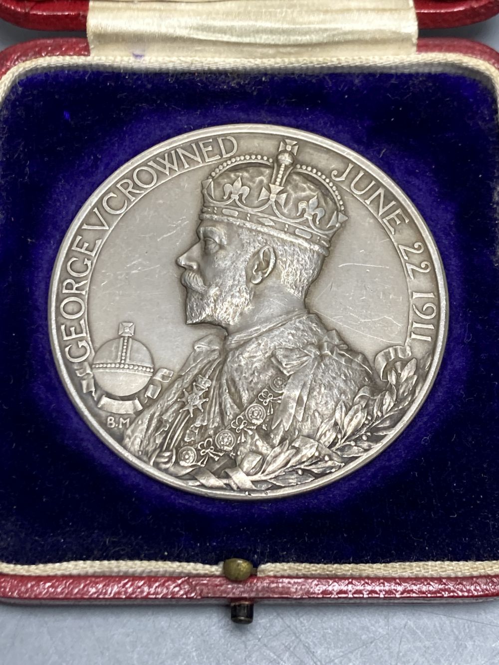 A cased George V silver coronation medal, 1911, by B. Mackennal, 51mm, 85g, GVF